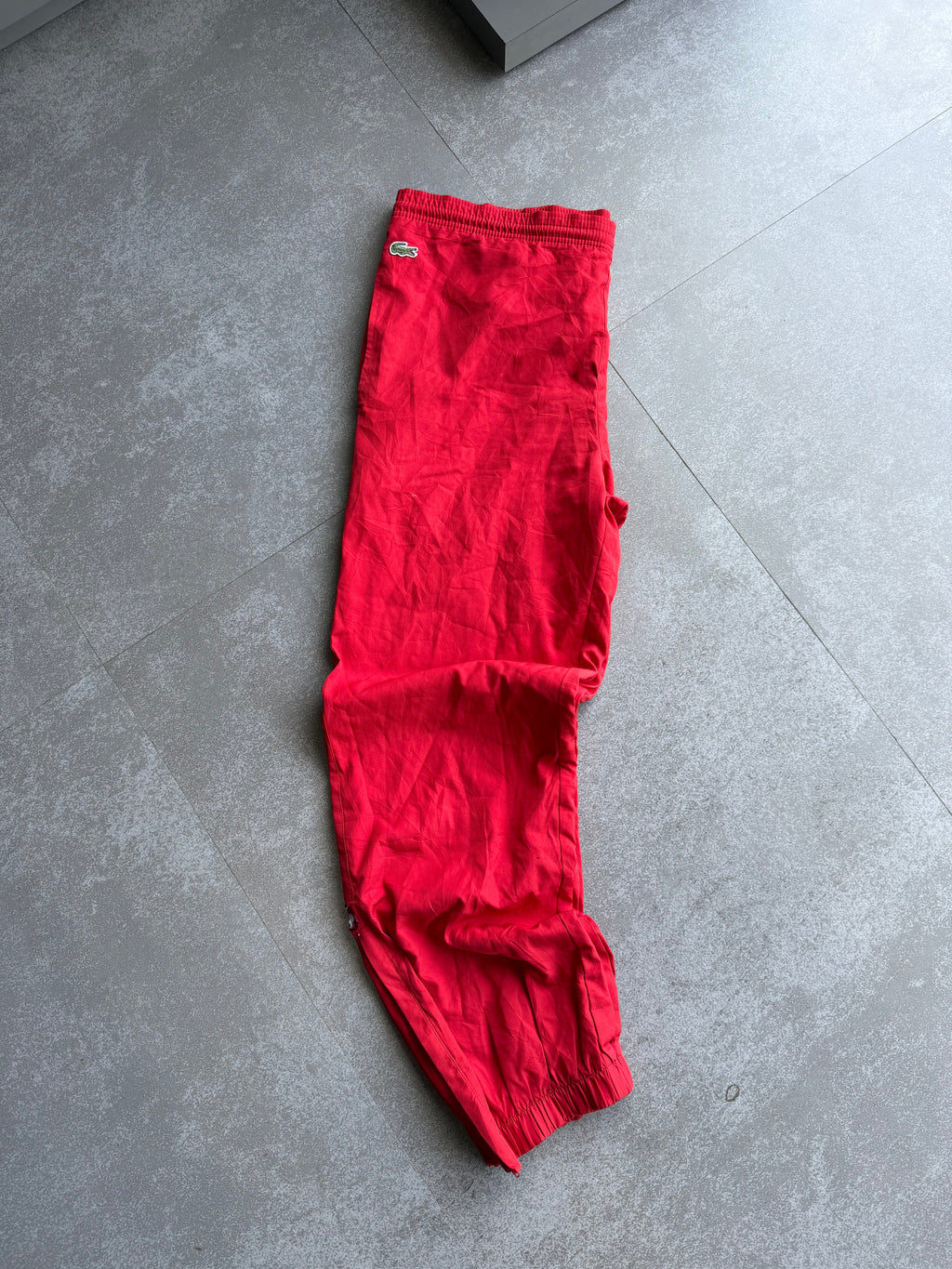 RED LACOSTE TRACK PANTS -XL
