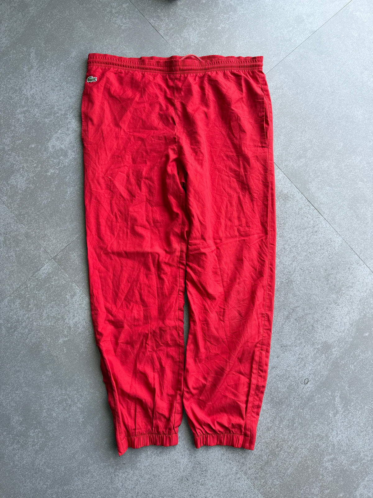 RED LACOSTE TRACK PANTS -XL