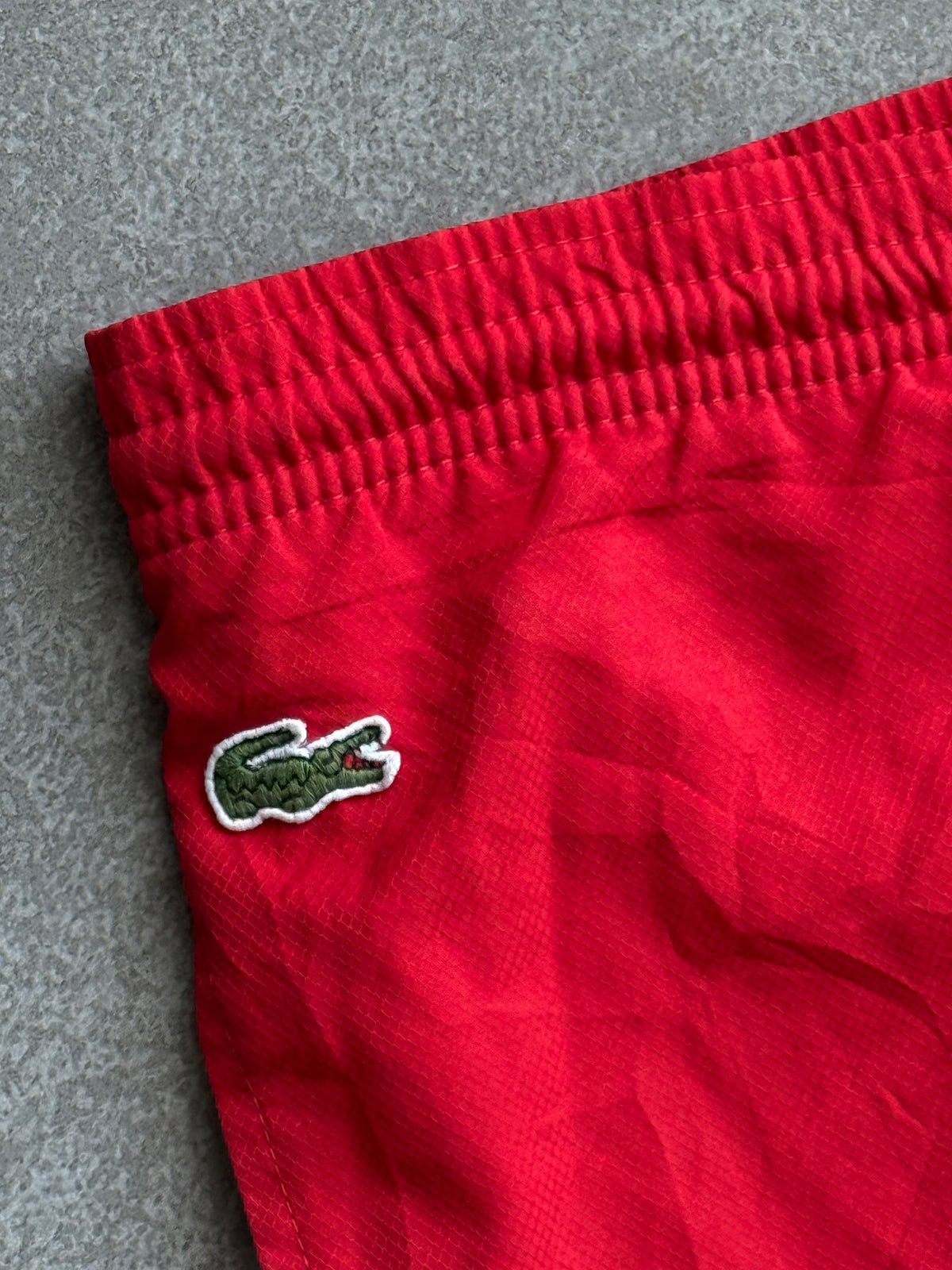 RED LACOSTE TRACK PANTS -XL